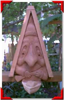 Carved Cedar Canoe-ist Bird House