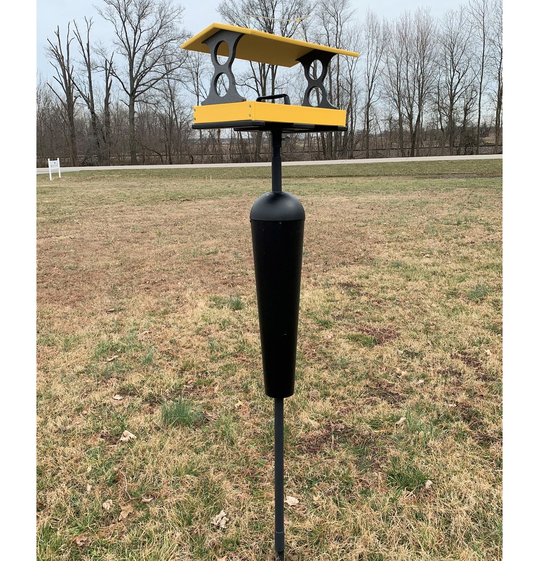 https://www.songbirdgarden.com/store/prodImages/ProdImages_Extra/20267_Yellow-Gray-5-Large-Fly-Through-Bird-Feeder-with-Squirrel-Proof-Pole-1.jpg